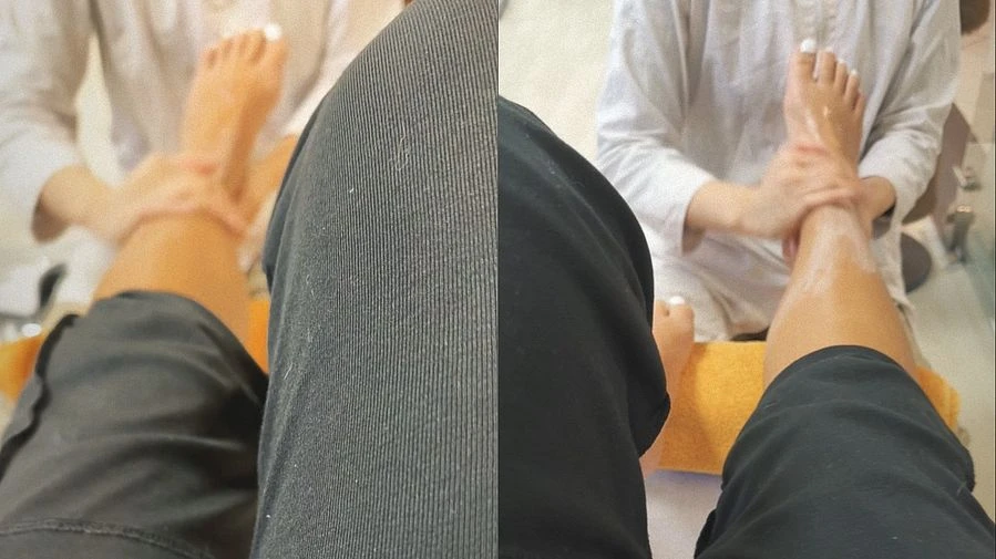 Goettin werden Fuesse eingecremt und massiert